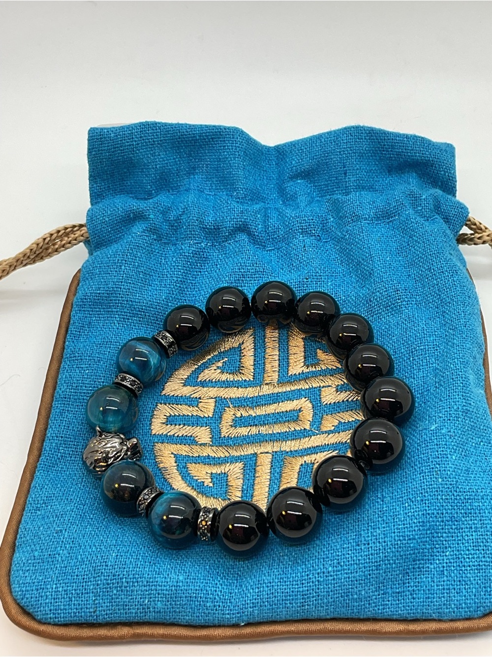 Blue and Black Beaded Stretch Bracelet with Wolf Charm